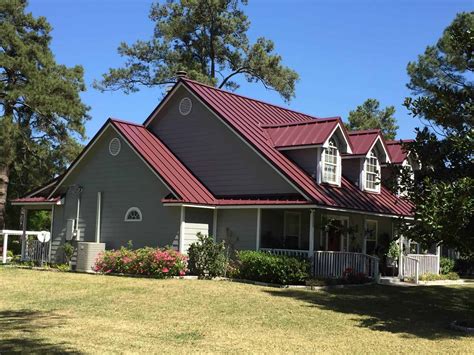 red metal roof gray house|colonial red roof.